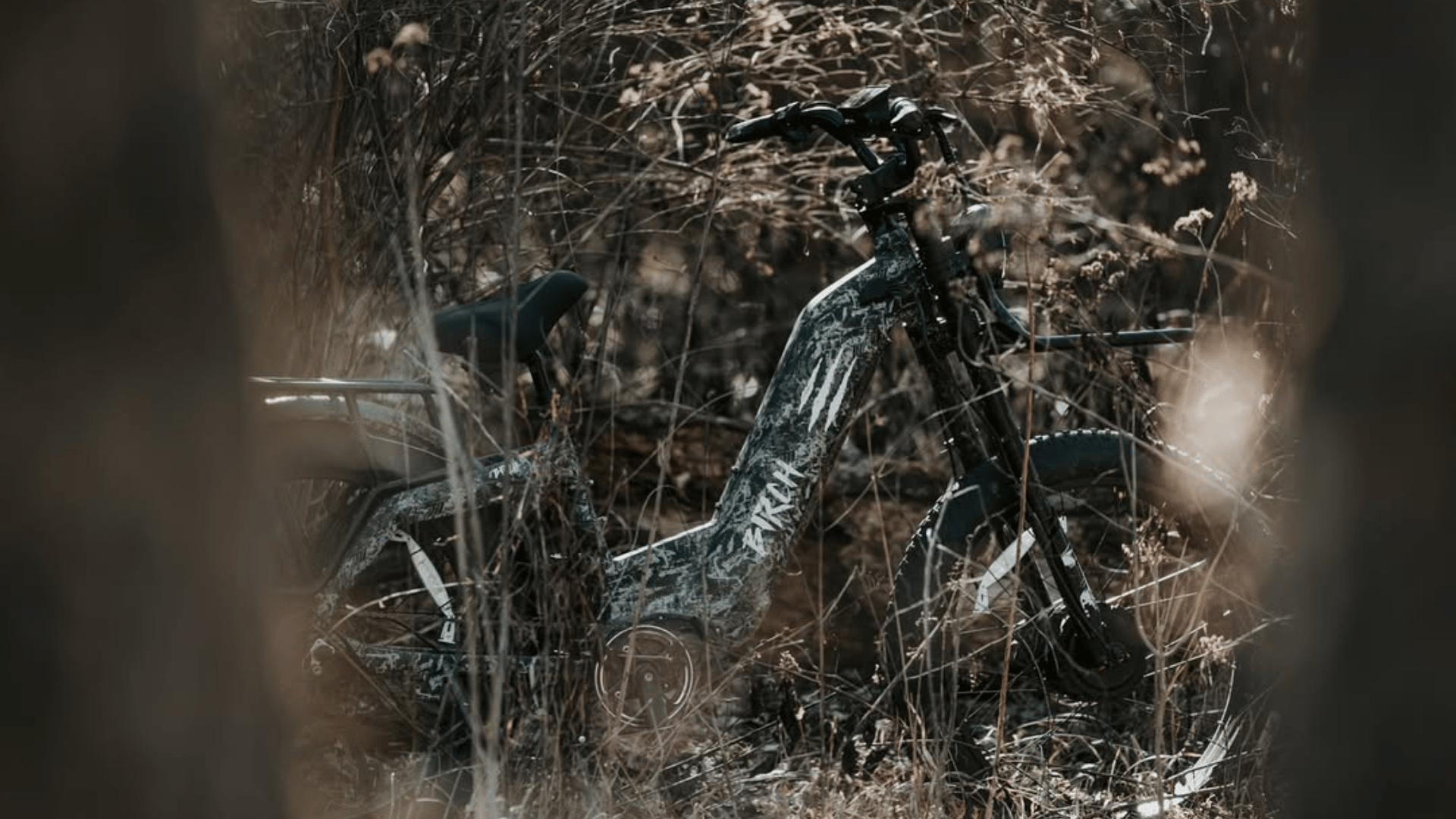 black and white ebike amongst the trees