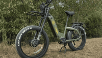 green Birch Grolar hunting ebike in front of trees